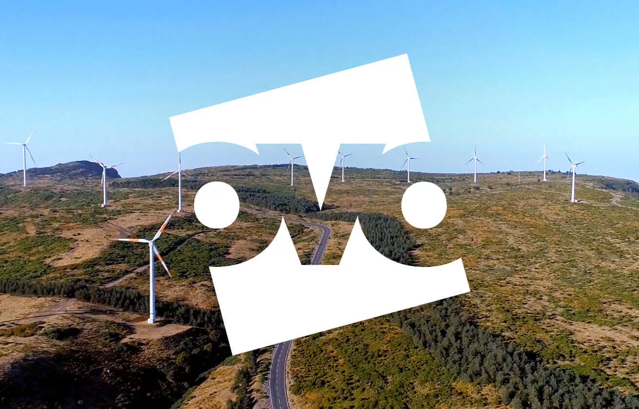 Beautiful landscape with wind turbines and Ovo logo on top of them