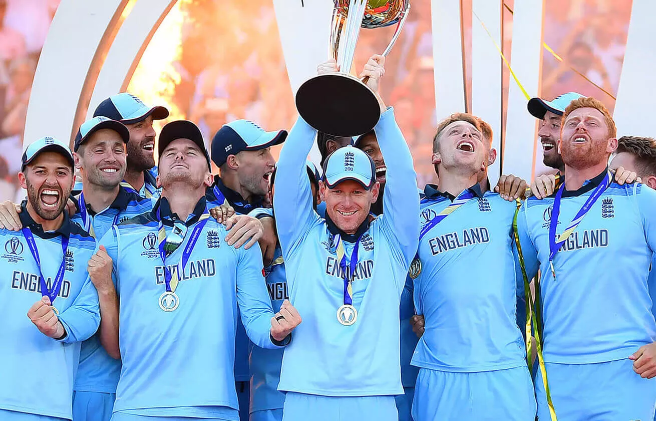 England cricket team holding a big trophy above their heads